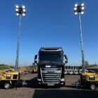 Lighting tower illuminating event site at night